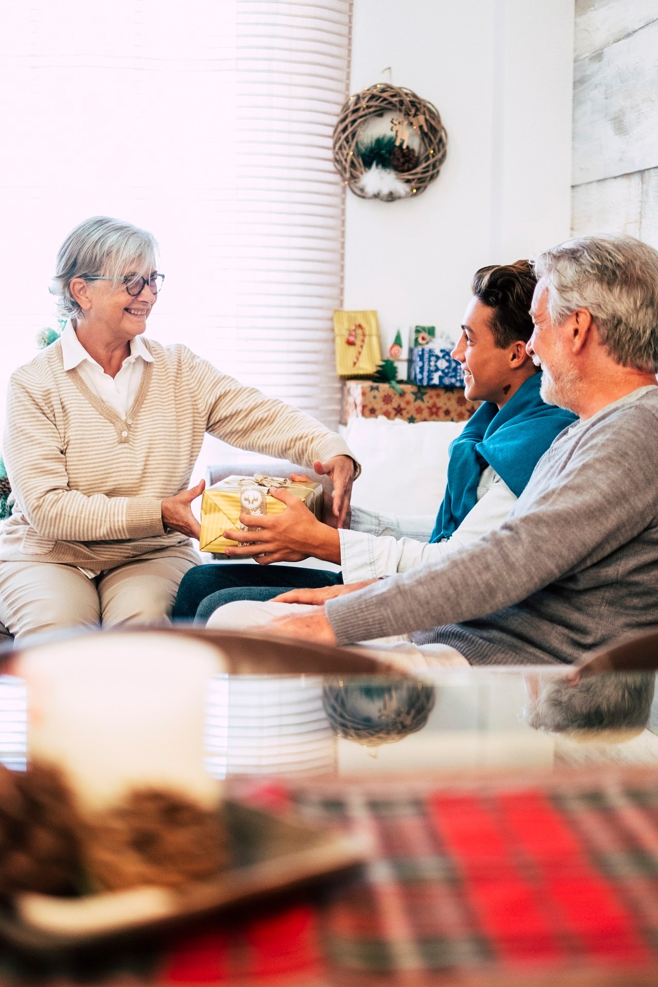 gift share Family group people enjoy day together in christmas days season - happy caucasian enjoy food and indoor leisure activity at home during holidays time - mixed generations young to old